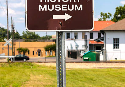 Hattiesburg, MS, USA - June 6th, 2015: Brown and white street sign for the African American Military History Museum in Hattiesburg Mississippi.